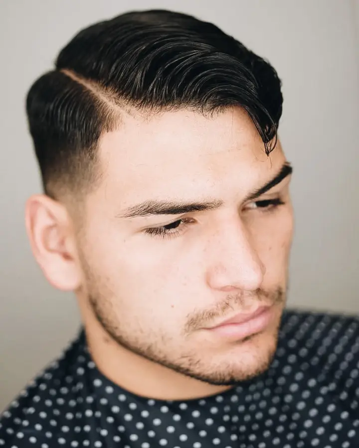 low taper fade with side part comb over
