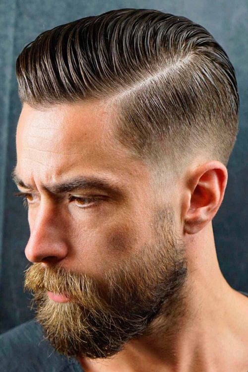 low taper fade comb over with part and beard