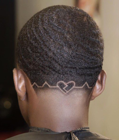 low taper fade with design black male