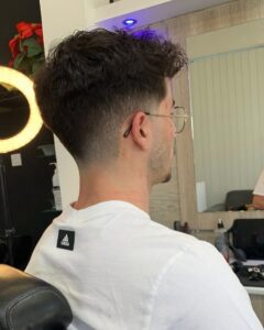 Low Taper Fade Straight Slicked Back Hair